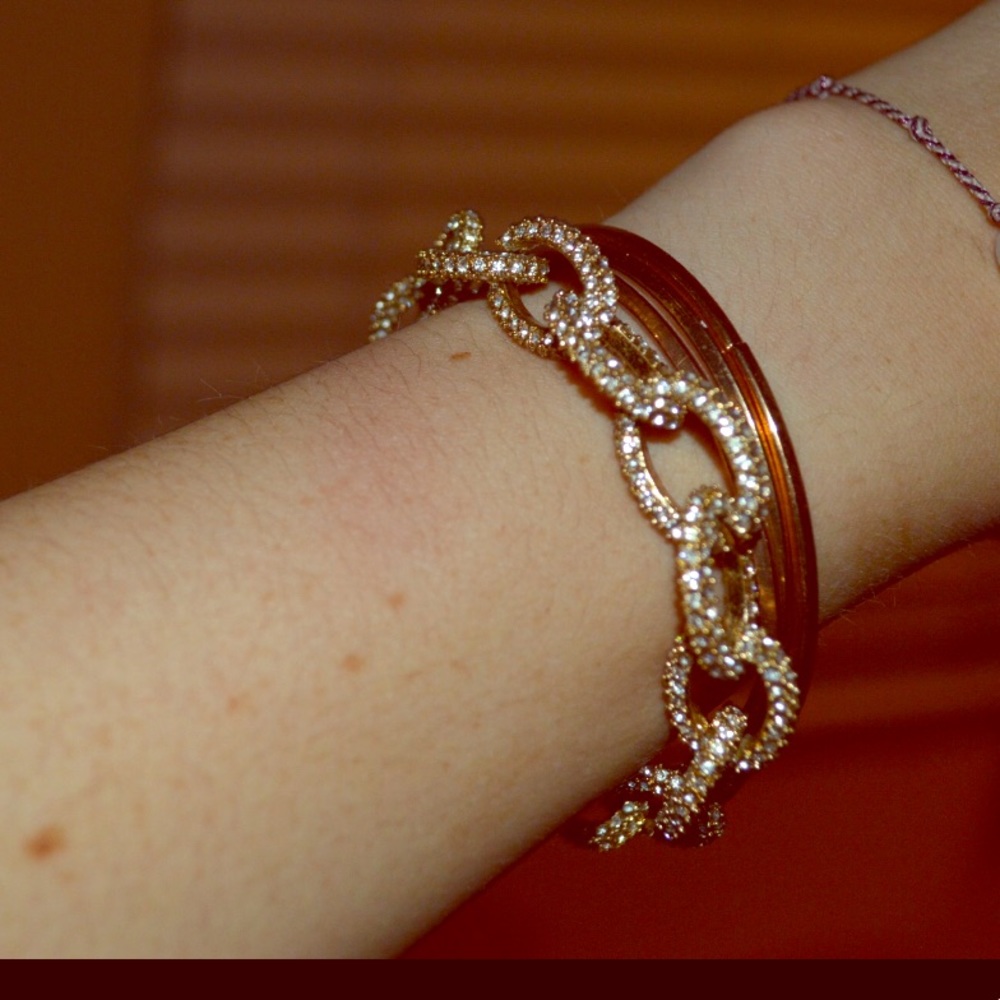3 gold bands and a zales bracket